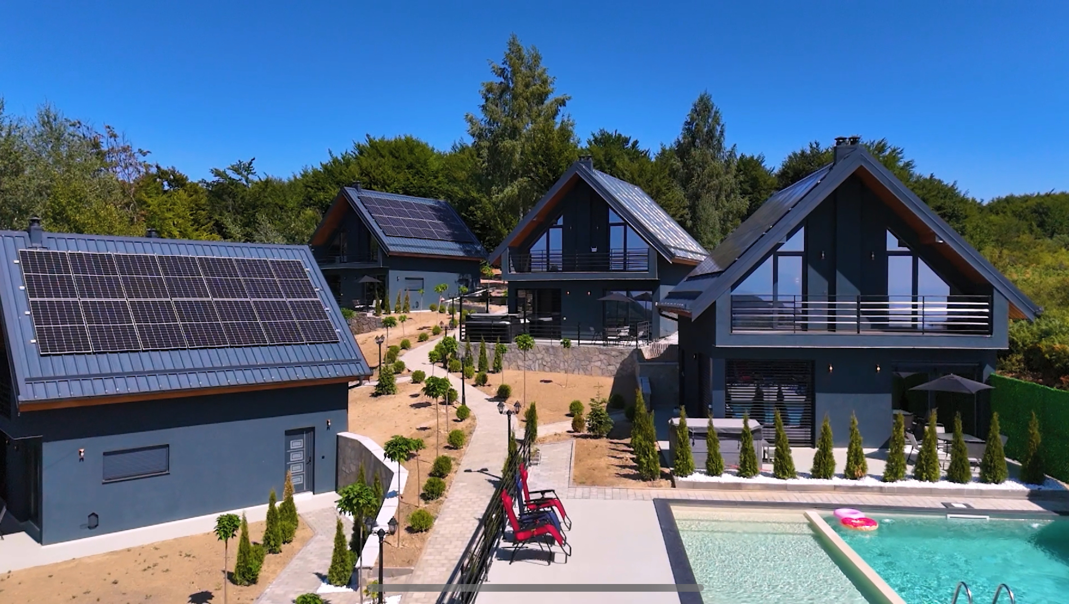 Aerial view of the Te Astra villas and pool in the mountains of Shtrazë